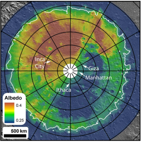 Cryptic region on the south pole of Mars. This is albedo (=reflectivity) data from the Mars Odyssey Thermal Emission Spectrometer (TES) draped over a MOLA (Mars Orbiter Laser Altimeter) shaded relief background showing considerable brightness variations. The low albedo region from 2 o’clock (300W) to 7 o’clock (160W), within the thermally defined extent of the seasonal cap (at lower right), is the cryptic region. Meridians and parallels are spaced every 30° and 5°, respectively. The zero meridian is pointing straight up. The indicated regions (with informal names) are areas that were selected for repeated coverage throughout the spring. Manhattan in particular was selected based on earlier observations from Odyssey’s THEMIS instrument